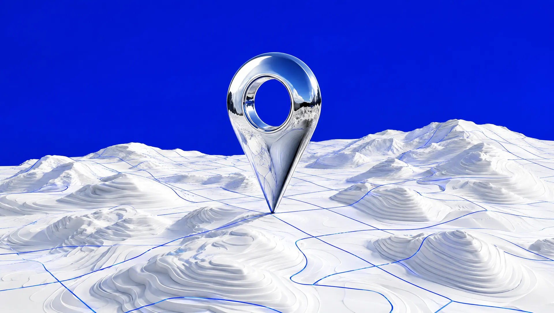 A chrome map pin standing on a white topographic landscape etched with blue grid lines