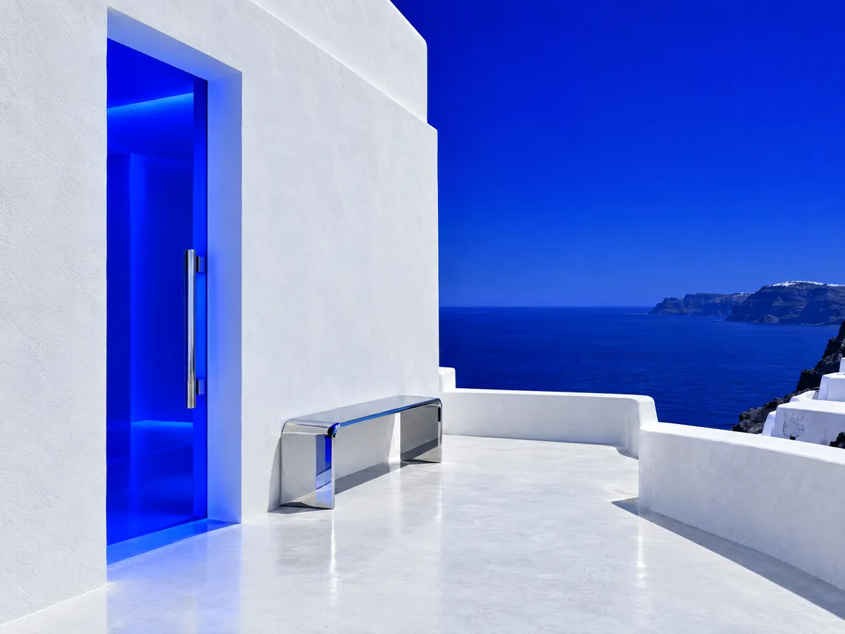 White building with a glowing blue doorway, loyalty programs